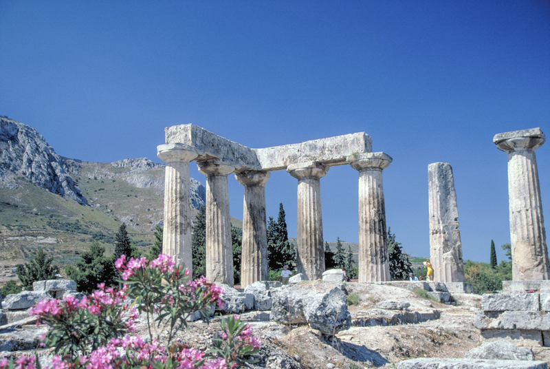 Temple of Apollo in Old Corinth with view of Corinth Acropolis in background