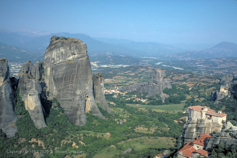 View of Roussanou Monastery. also note hermit caves in cliffs