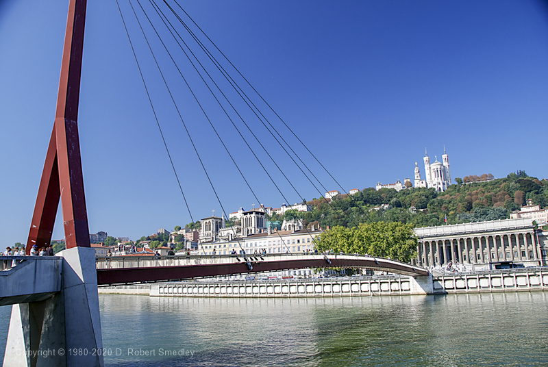 Pedestrian footbridge over the Saone with Notre-Dame de Fourviere Basilica on the hill overlooking Old Lyon